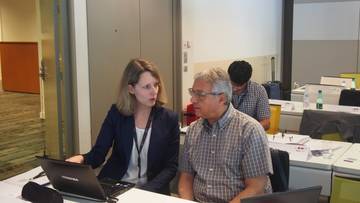 Verena Peuser, Research and Innovation Manager at Eurice discussing project details with Prof. Mondher Bouzayen.